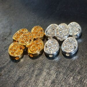 Lot de 10 perles ovales filigranées double face en alliage d’aluminium. Motifs ajourés élégants