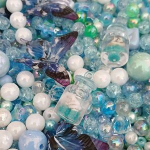 Une bouteille à la mer - collection de perles acrylique - tons bleus - pendentif bouteille et coquillage - papillons bleus.
